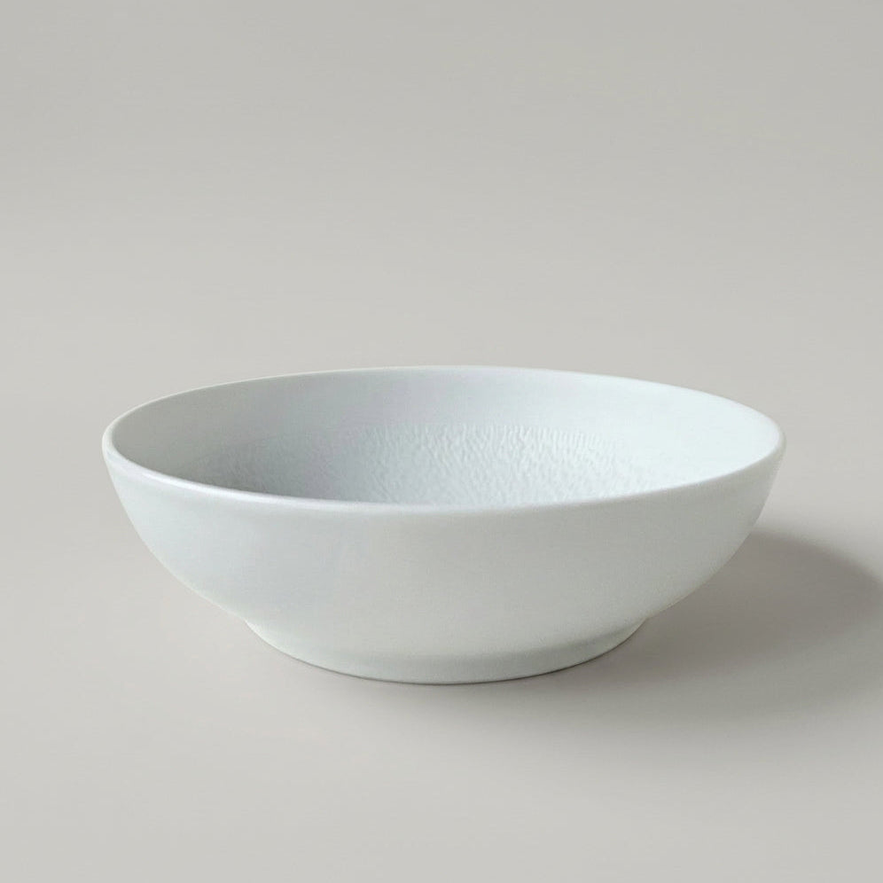 Ensemble de quatre assiettes creuses – Minéral – Manufacture Raynaud – Limoges, début du XXIe s.