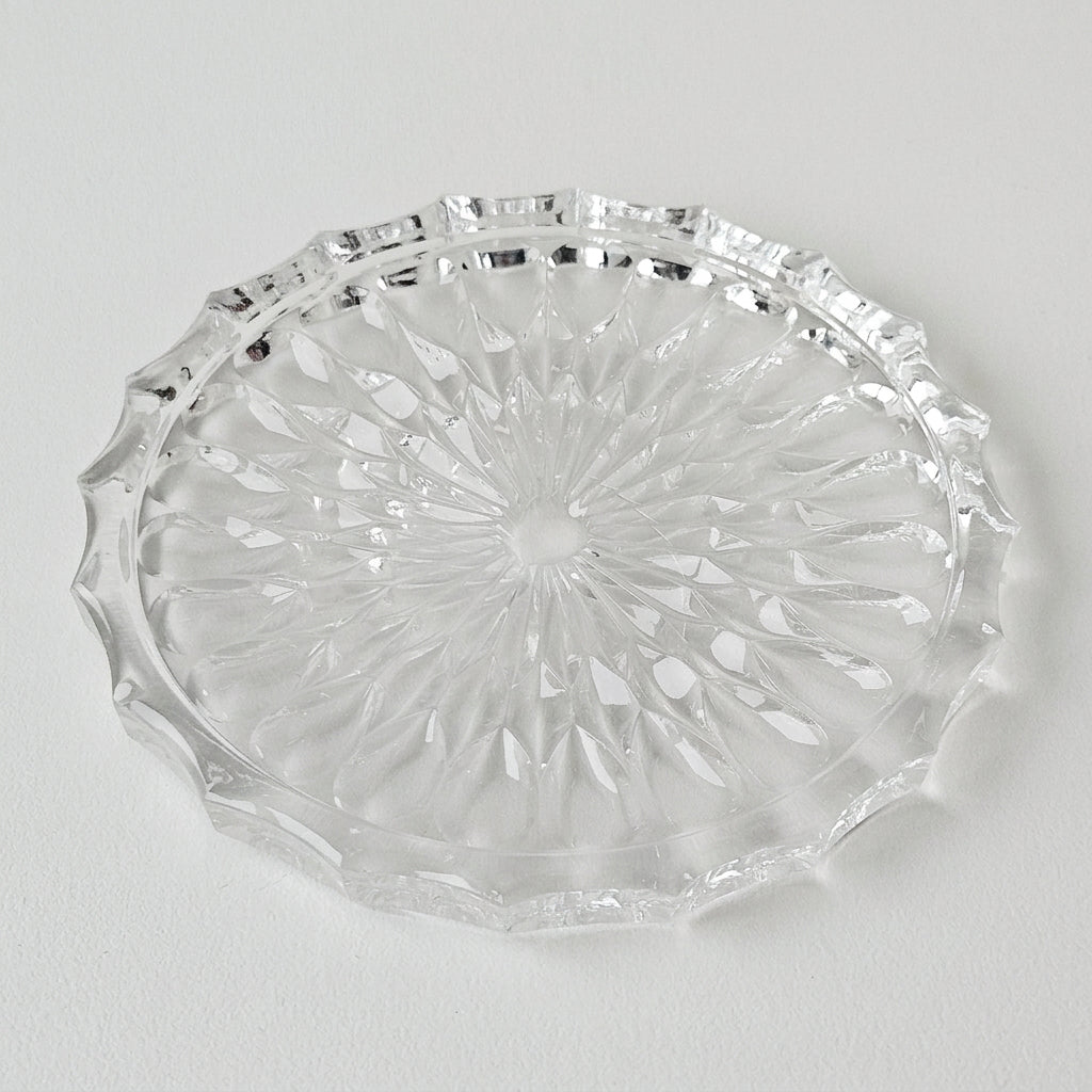 Dessous de bouteille en verre moulé à décor étoilé – XXᵉ siècle