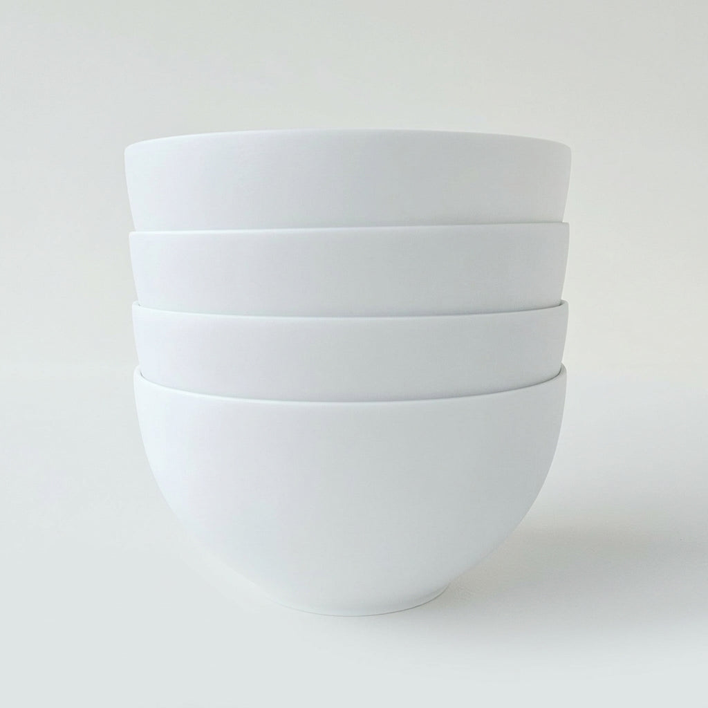 Lot de quatre bols en porcelaine fine – Contraste Biscuit / Émail – Saint-Léonard-de-Noblat, début du XXIe s.