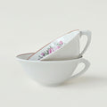 Paire de tasses à thé en porcelaine fine – Limoges, Milieu du XXe s.